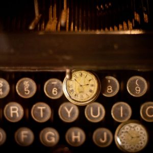 photo of antique keyboard and watch