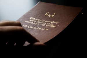 photo of Benjamin Franklin quote embossed on leather book cover