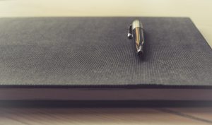 image of a writer's journal and fountain pen